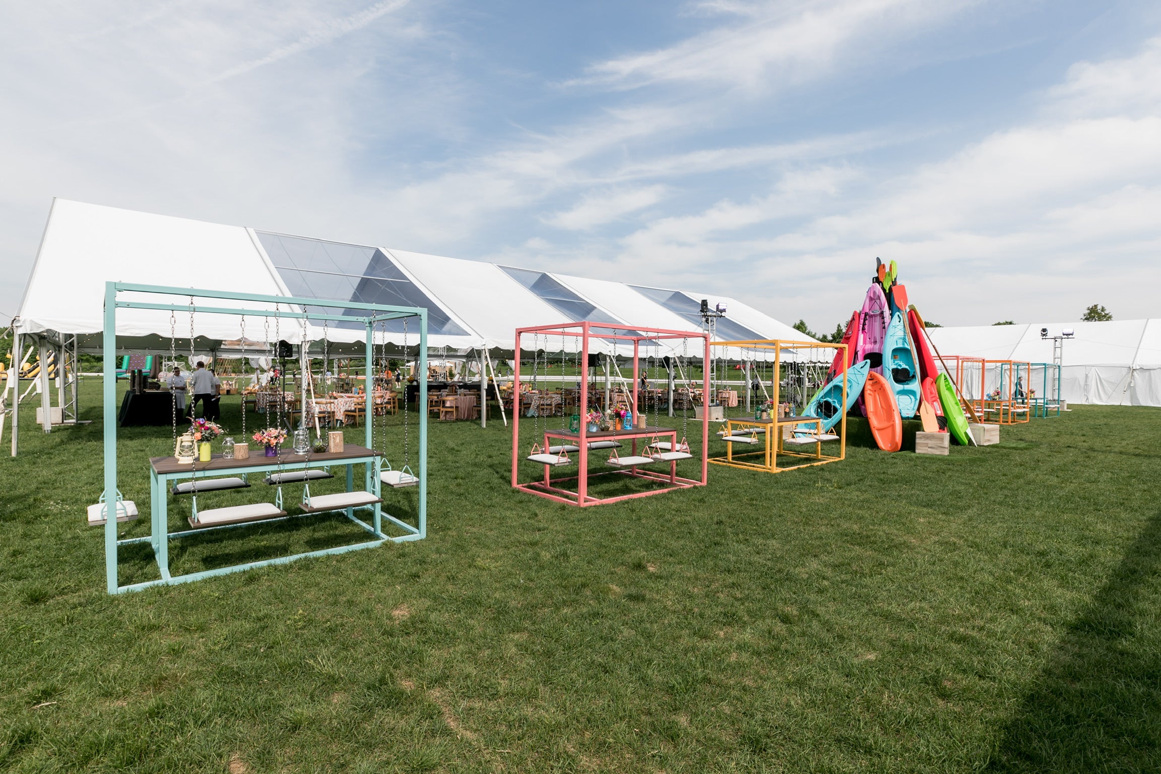 Custom colored 6-seater SwingTables at Event on Governor's Island in New York